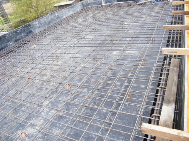 Steel reinforcement laid and tied for a concrete slab before the pour