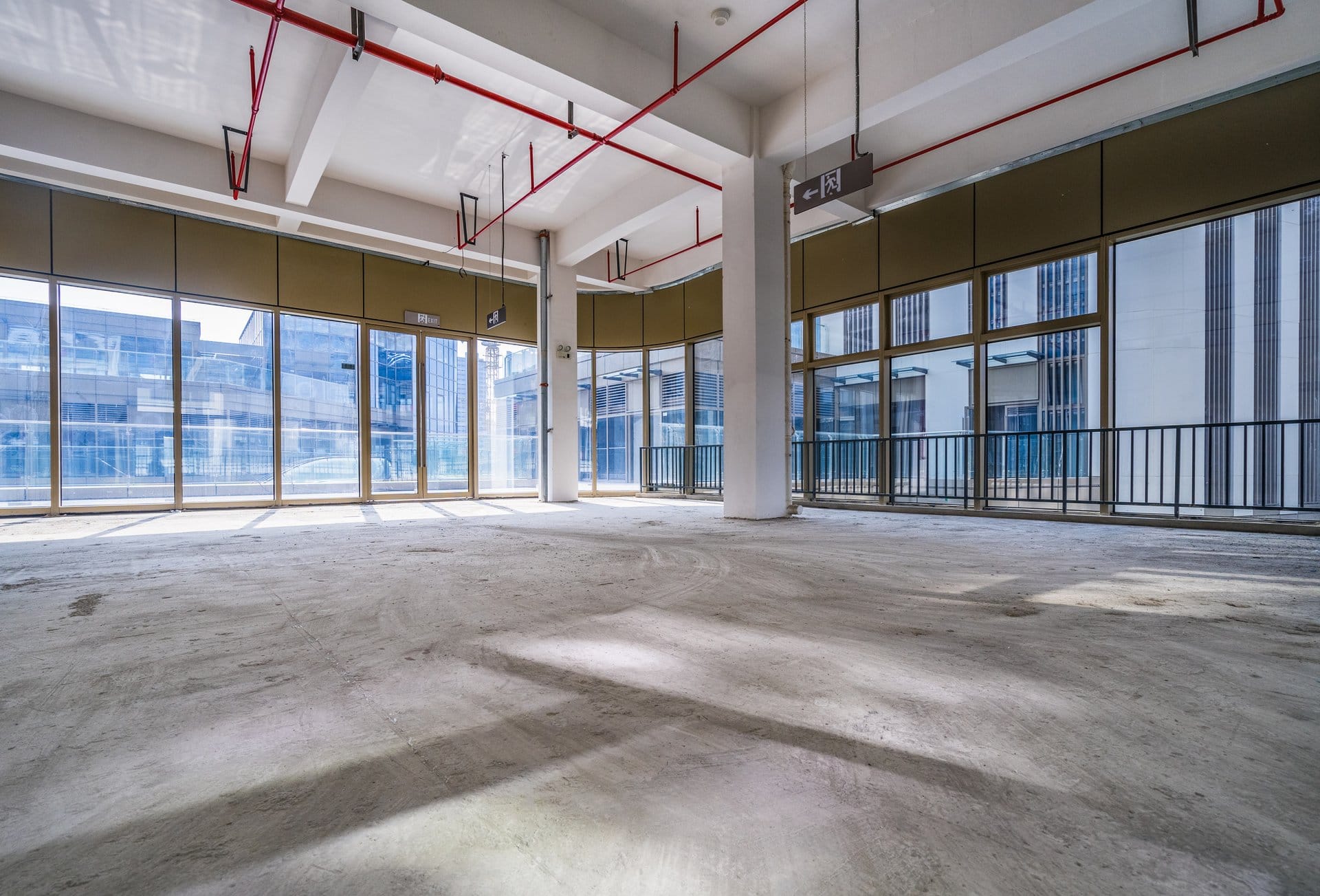 Bare commercial concrete floor slab in an open retail fitout space