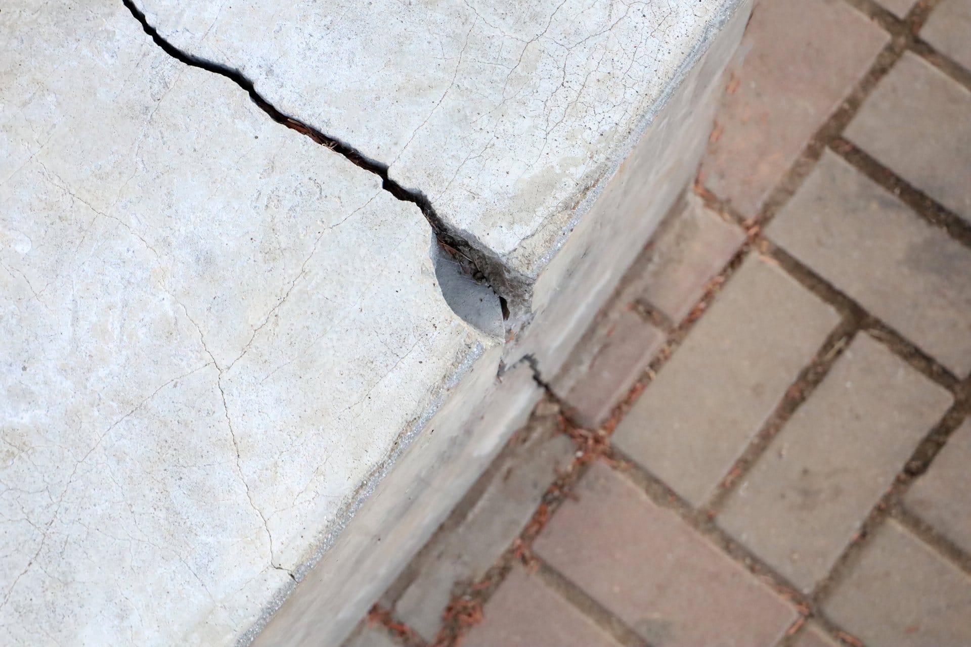 Cracking along the edge of a concrete slab, a warning sign of concrete cancer